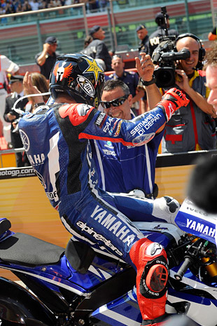 Team staff and rider Jorge Lorenzo celebrate their victory.