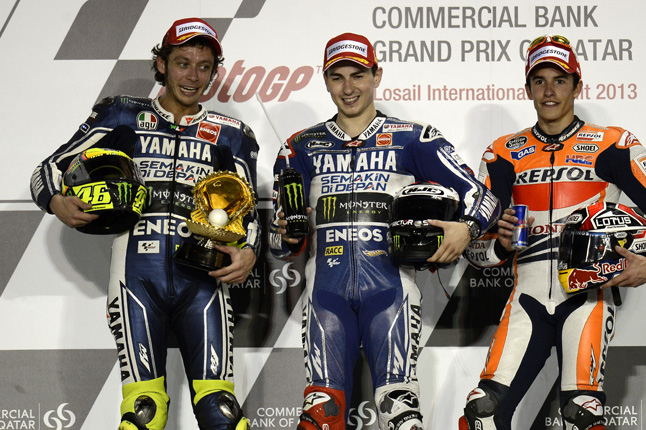 Valentino Rossi and Jorge Lorenzo on the victory podium.